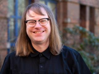 Headshot of Dr. Casey Check.