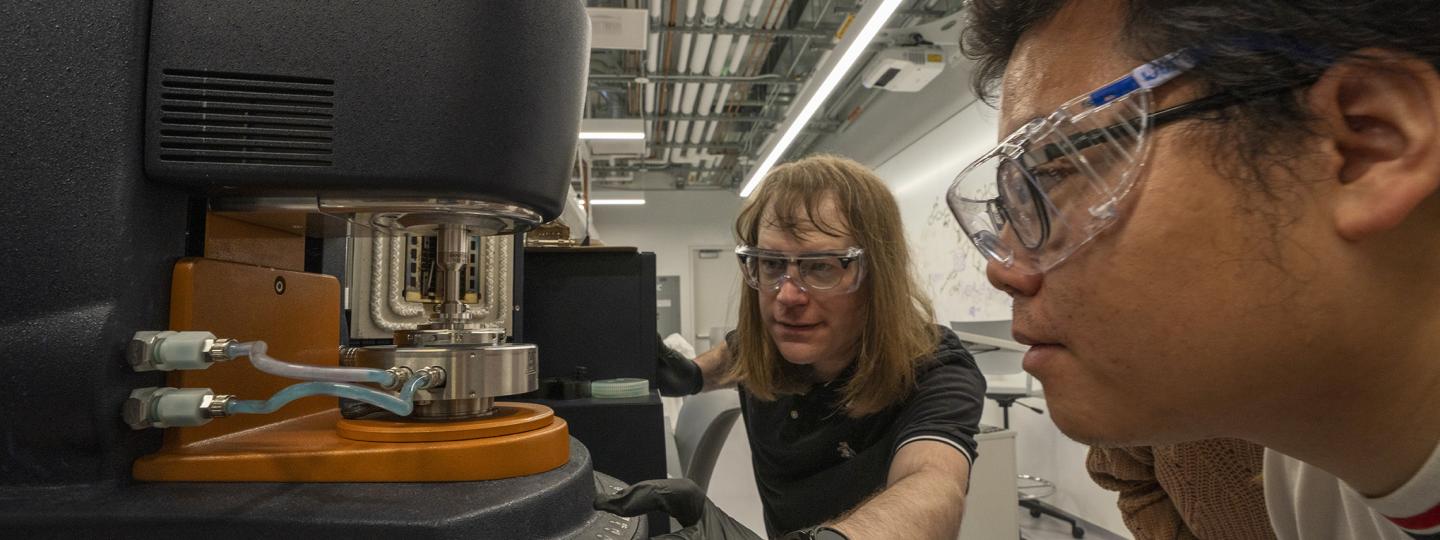 Two people work in the Polymer Characterization Facility.