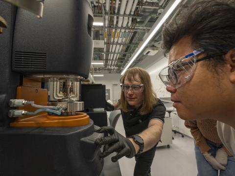 Two people work in the Polymer Characterization Facility.